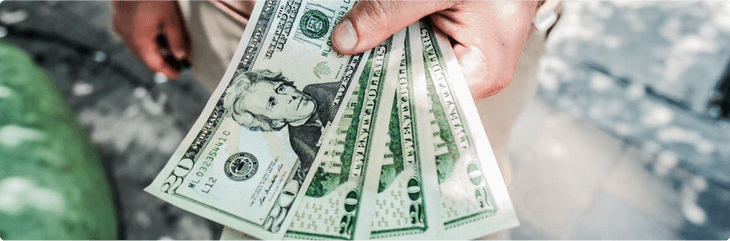 man holding money fanned out