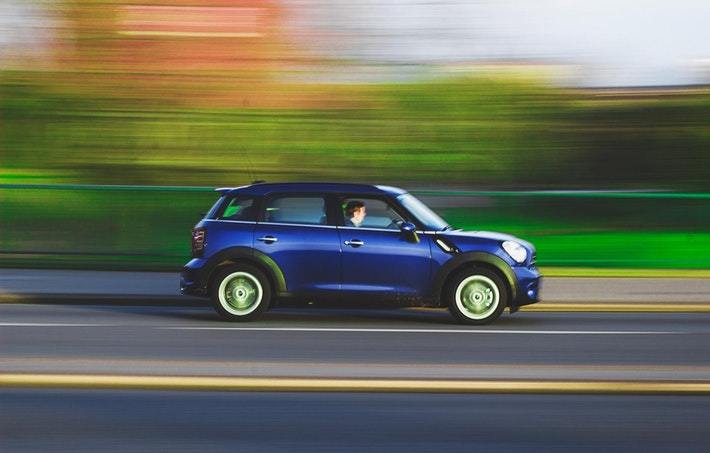 driving a blue car