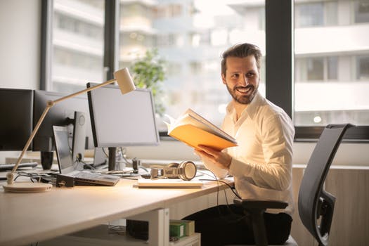 smiling man doing office work