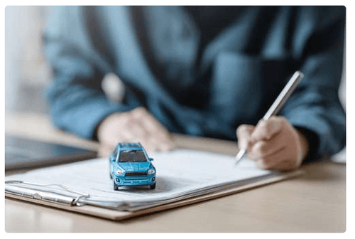 Loan application form displayed with a car to illustrate materials related to online title loan information