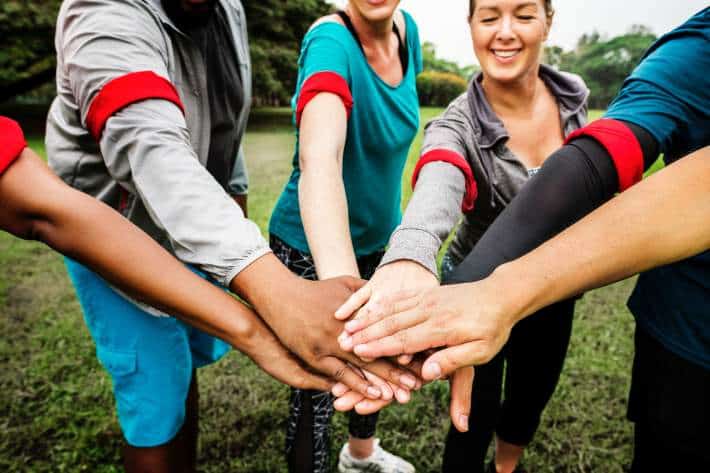 team holding hands