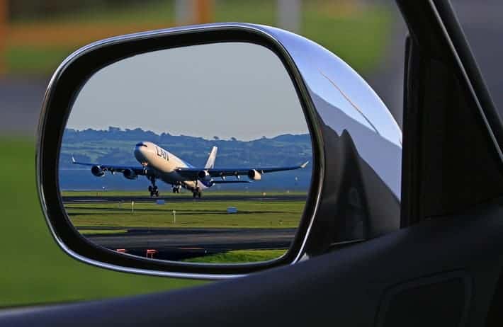 airplane in rear view mirror