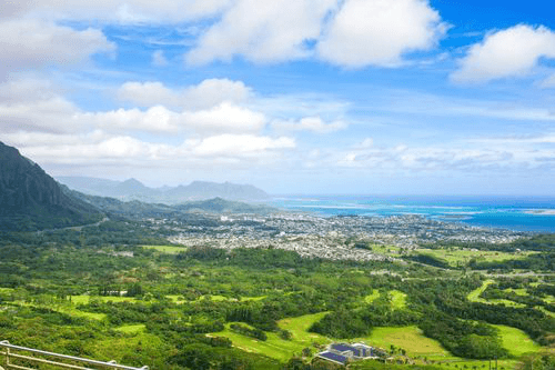 Beautiful view of Kaneohe as seen from high above on Pali Lookout towards the ocean and the city of Kaneohe